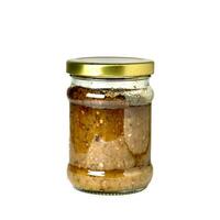 Crushed green chili or sambal ijo seasoning condiment in glass jar container isolated on square white background. photo