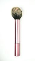 One blush and foundation make up brush with pink handle tool isolated on vertical white background. photo