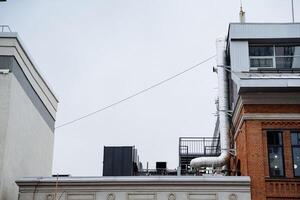 A structure that features a chimney located at the very top of it, which serves as a significant architectural element, contributing to the overall design and functionality of the building photo
