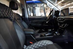 This image captures a detailed close up of the interior of a car parked in a garage, focusing on various design elements and components that contribute to its overall aesthetic appeal photo