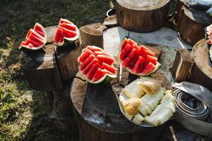 The photo features a stylish display of watermelon and bananas on a wooden board, creating a contemporary and simple food arrangement that captures attention with its elegance