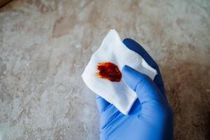 This image captures a closeup view of a blood stain on a tissue within a medical setting, highlighting crucial aspects of healthcare photo