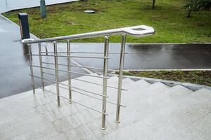 A stainless steel railing on stairs not only offers support and safety but also adds a modern touch to the property. Its sleek design complements the contemporary aesthetic of the space photo