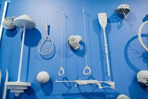 A blue wall is adorned with an assortment of white objects that add a striking contrast, capturing the essence of a clean and refreshing aesthetic. It evokes a sense of calm and purity photo