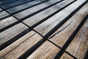 This image features a close up of a beautiful wooden floor showcasing a diagonal pattern that enhances the visual appeal of the hardwood used in its making, giving it character and style photo