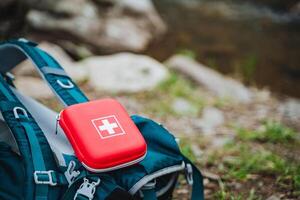 Stay safe on your outdoor adventures with a compact and portable first aid kit in your backpack. Be prepared for any emergency in the wilderness or on the river photo