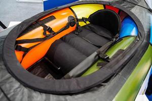 This is a detailed description of the interior of an inflatable kayak, which includes a comfortable seat designed for optimal support during water activities and adventures photo