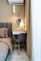 Imagine a cozy bedroom with a soft bed, stylish desk, supportive chair, and elegant mirror, all creating a serene atmosphere perfect for relaxation at the end of the day photo