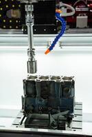 Setting up precision machining processes for the fabrication of automotive engine blocks is crucial for manufacturing efficiency and quality control photo