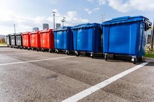 A vibrant and colorful row of recycling bins designed specifically for effective waste management and promoting environmental cleanliness photo