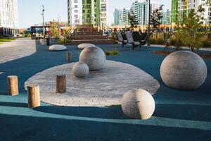 A collection or group of colorful balls can be seen resting on a vibrant blue surface in a beautiful park, providing an inviting atmosphere for leisure and relaxation in the outdoors photo