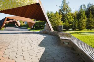 A beautifully constructed brick walkway is visible, complemented by a charming wooden structure located in the background, enhancing the overall aesthetic of the outdoor scenery photo