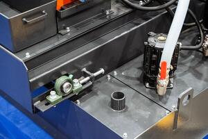 A close up of a machine with a hose coming out of it photo