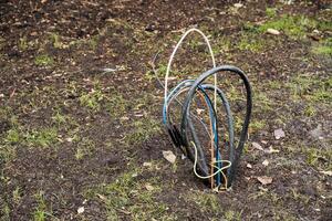 Scattered across the ground is a chaotic and tangled mass of wires that draws the eye, sparking intrigue and prompting questions about its origin and purpose in the surrounding area photo