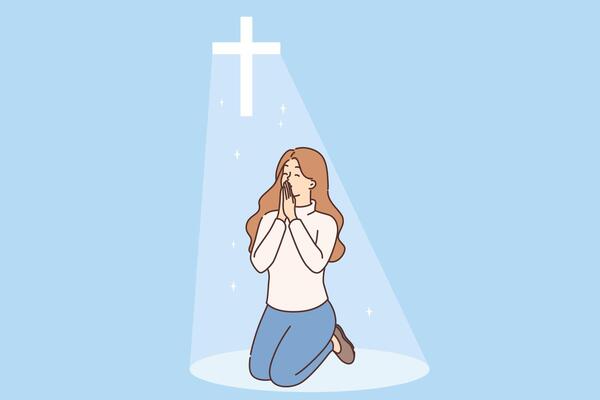 Christian woman prays on knees under religious crucifix or cross emitting bright light