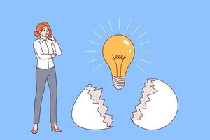 Business woman who has come up with new idea stands near light bulb that emerged from eggshell vector