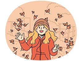 Little girl throws up leaves of autumn trees walking in park and rejoices at end of summer vector