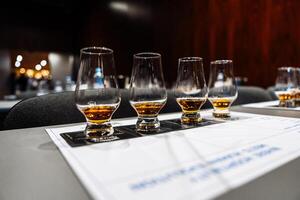 Enjoying a whiskey tasting session during a cocktail preparation event photo