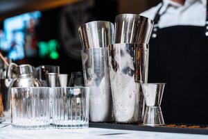Cocktail preparation at an alcohol tasting event featuring mixing tools photo