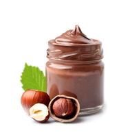 Chocolate paste with filbert nuts on white backgrounds photo