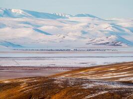 Authentic small town in the distance is covered with snow in the photo
