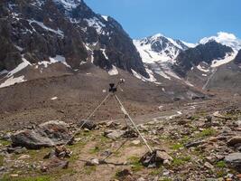 Automatic weather station in the mountains. Distant mountain range, obtaining seismic and meteorological data. photo