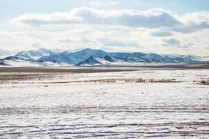 Snow mountain steppe in Mongolia. photo