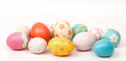 Decorative Easter eggs with colorful patterns and floral designs arranged on white background. Perfect for holiday themed projects photo