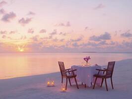 romantic dinner setup on beach with candles and flowers at sunset photo