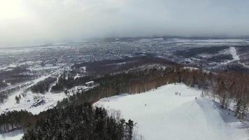 Drone view of the ski slope with people skating at the Gorny vozduh resort. video