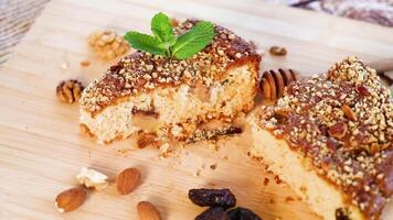 Sponge cake with prunes and nuts on wood video