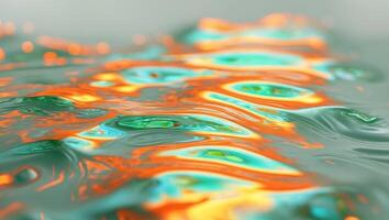 Abstract image of water surface with orange and green reflectionsAbstract image of water surface with orange and green reflections. photo