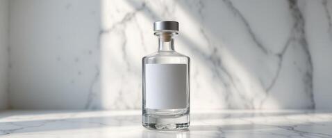 Elegant liquor bottle with blank label resting on marble surfaceElegant liquor bottle with blank label resting on marble surface. photo