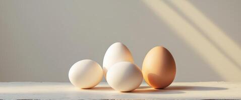 Fresh Raw Eggs and Half Boiled Egg on Clean Textured Surface with Natural LightingFresh Raw Eggs and Half Boiled Egg on Clean Textured Surface with Natural Lighting. photo