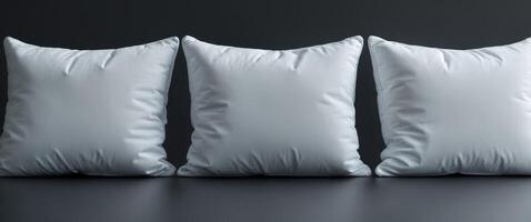 Three Empty White Cushions on Black Background for Creative Use photo