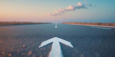 Asphalt Road with White Arrow Forward Symbolizing Motivation and Progress in Golden Hour Lighting photo