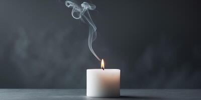 Tranquil White Candle and Smoke on Dark Background - Copy Space for Business ConceptTranquil White Candle and Smoke on Dark Background - Copy Space for Business Concept. photo