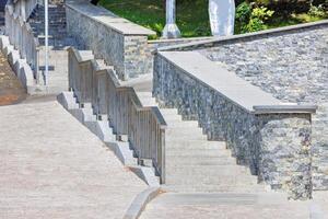 Stone staircase in modern architecture of urban landscape design. photo