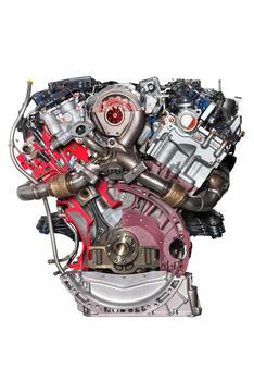 The design of the internal combustion engine of a modern car on a stand showing a section of partial elements. photo