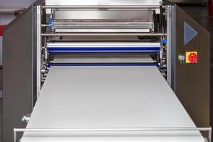 The dough forming machine guarantees the same shape, size and weight of dough products. photo