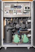 Refrigeration equipment of a compressor-condenser station with an electronic controller unit. photo