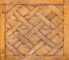 Texture and expressive wooden background made from old oak rectangular wooden planks crisscrossed. photo