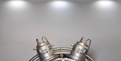 Fragment of a modular power plant on a gray background with spot lighting. photo