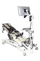 Medical examination table with a monitor and computer setup used for patient assessments in a clinical environment. Isolated on a white background. photo