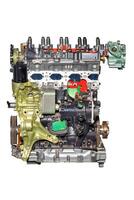 Modern car engine demonstrating advanced automotive technology, isolated on white background. photo