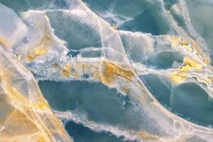 Blue onyx marble stone surface showing natural pattern for design. photo