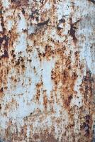 Rusty Metal Surface with Natural Corrosion Patterns in Close-Up View Displaying Textured Weathering Effect, decay concept. photo