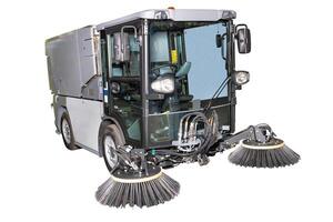 Advanced Street Sweeper Machine with Rotating Brushes for Urban Cleaning, Isolated on White Background, Efficient Cleaning Concept photo
