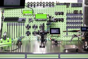 Advanced diagnostic tools and modern industrial equipment in workshop setup in an organized workplace, the concept of machine calibration. photo