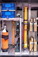Organized emergency tools and equipment compartment with safety gear, neatly stored and secured in vehicle for quick access concept photo